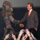 Illustration for article titled And now, Arnold Schwarzenegger cordially shaking hands with the Predator